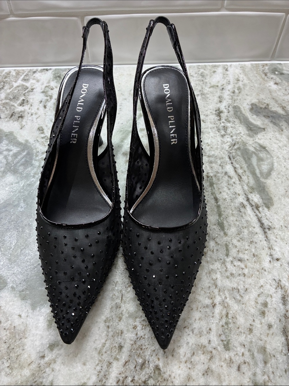 Donald J. Pliner Black Studded Pointed Slingback Pumps in black mesh.